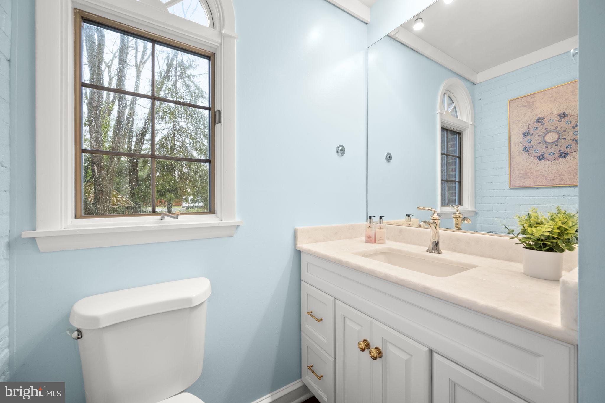 332 South Providence Road Wallingford, PA 19086 - Photo 22 of 69 a bathroom with a sink and a mirror