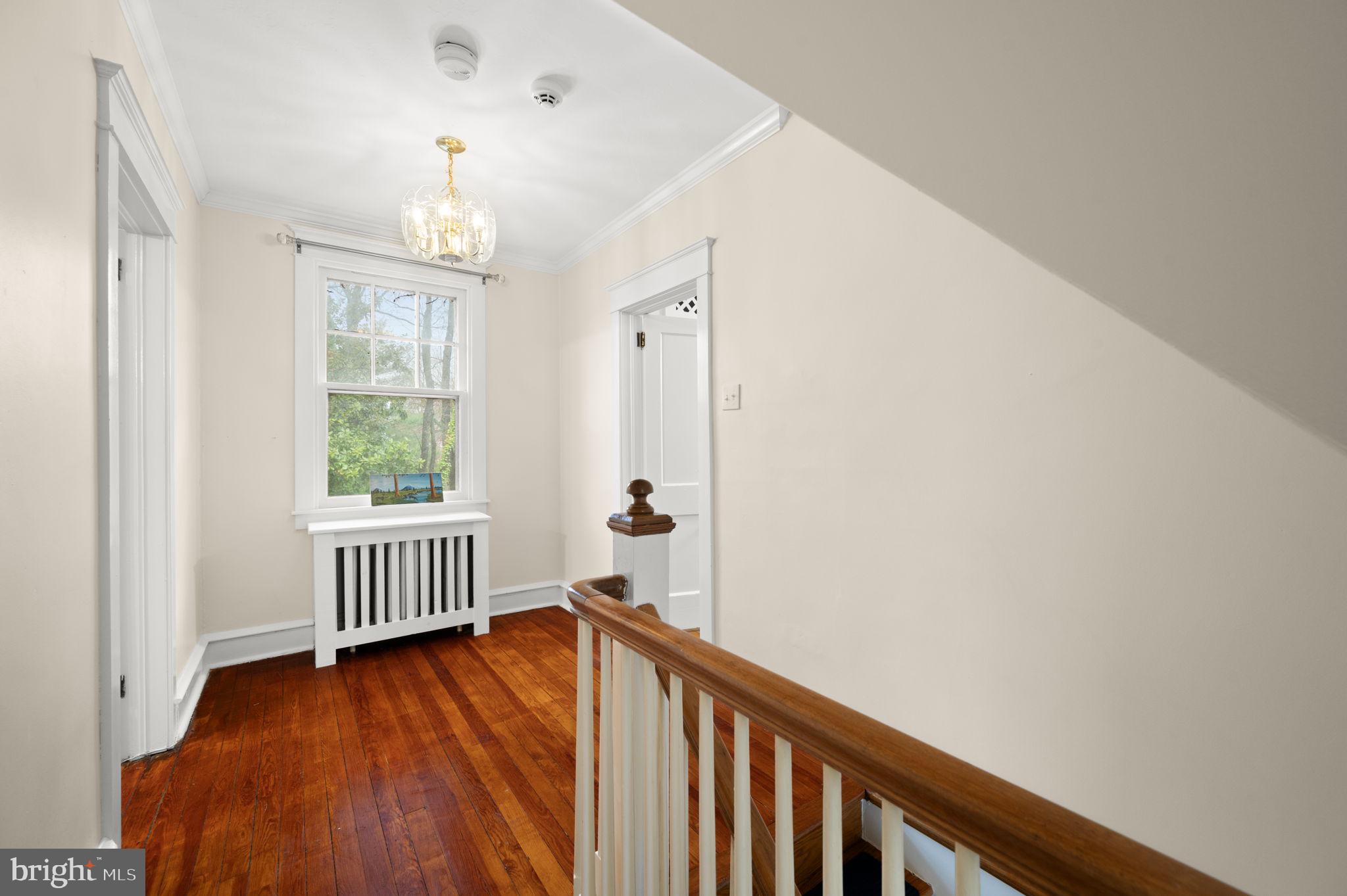 332 South Providence Road Wallingford, PA 19086 - Photo 25 of 69 a view of a hallway with wooden floor and staircase