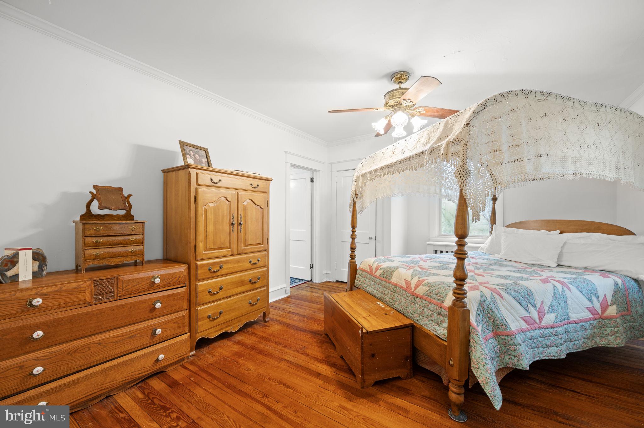 332 South Providence Road Wallingford, PA 19086 - Photo 27 of 69 a bedroom with a bed and wooden floor