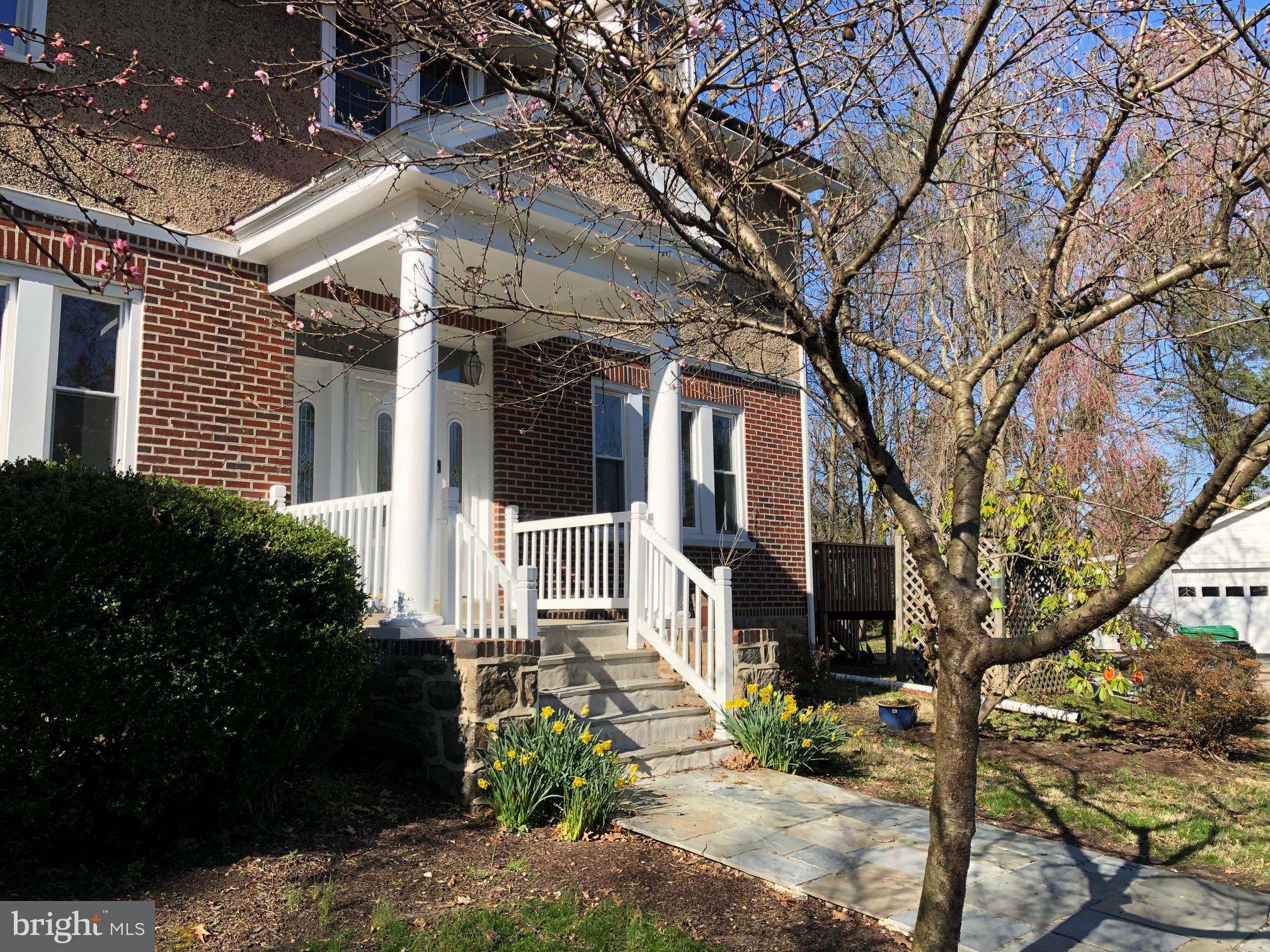 332 South Providence Road Wallingford, PA 19086 - Photo 3 of 69 a front view of a house with a garden