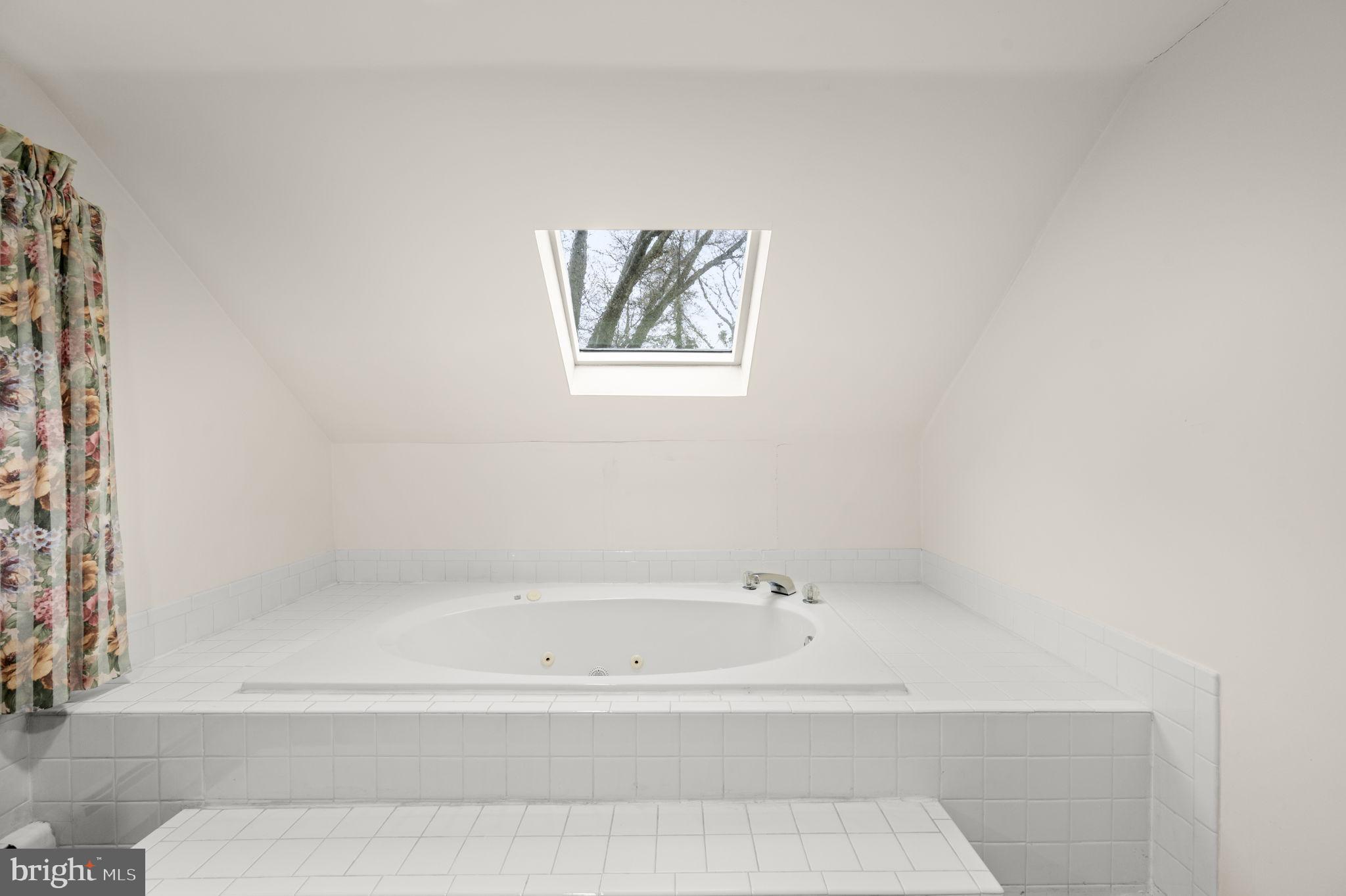 332 South Providence Road Wallingford, PA 19086 - Photo 38 of 69 a white bath tub sitting next to a white wall