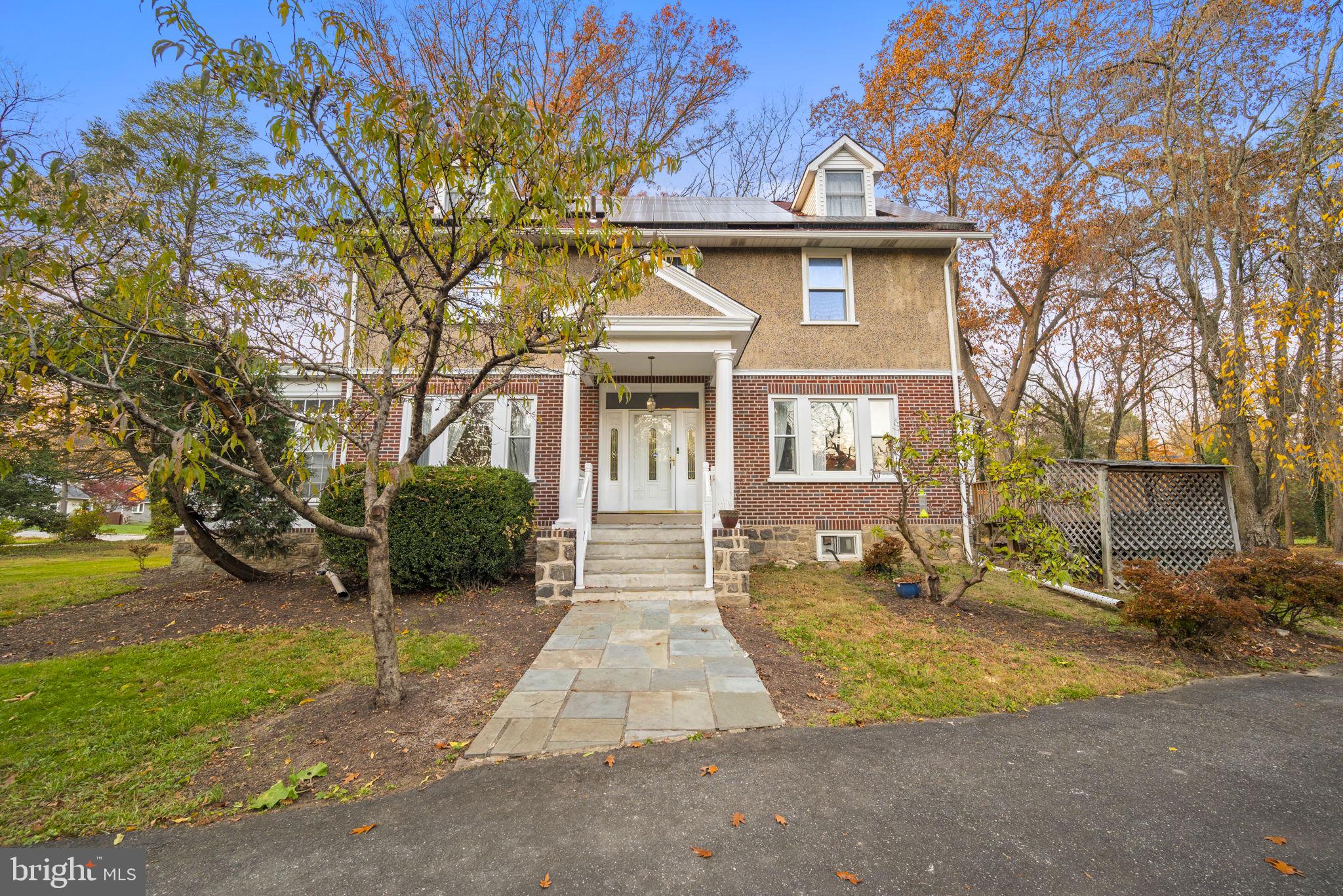 332 South Providence Road Wallingford, PA 19086 - Photo 5 of 69 a front view of a house with a yard