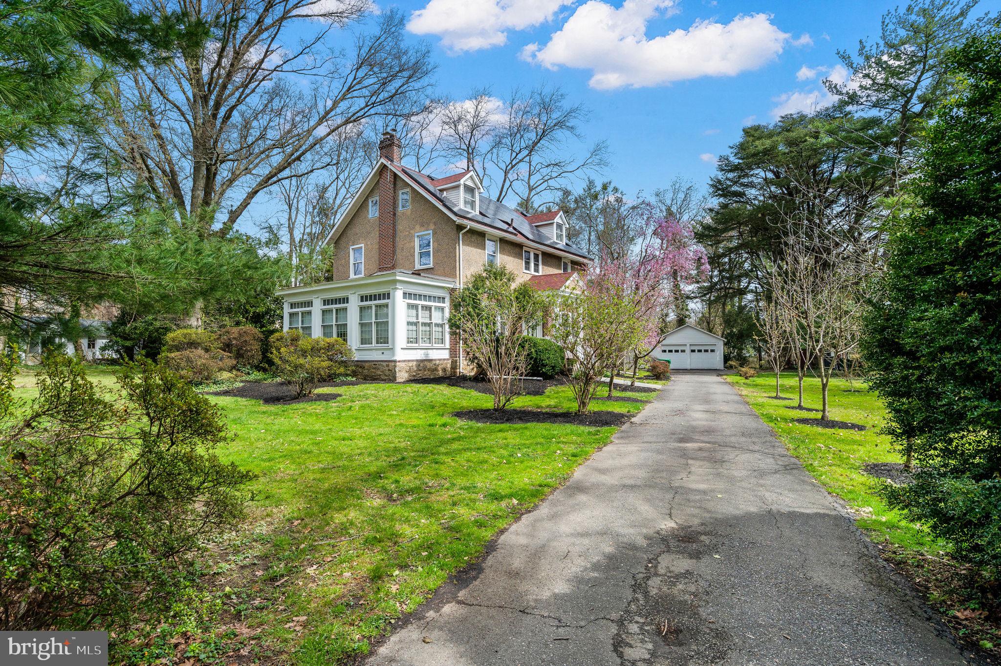 332 South Providence Road Wallingford, PA 19086 - Photo 69 of 69 a front view of a house with yard and green space