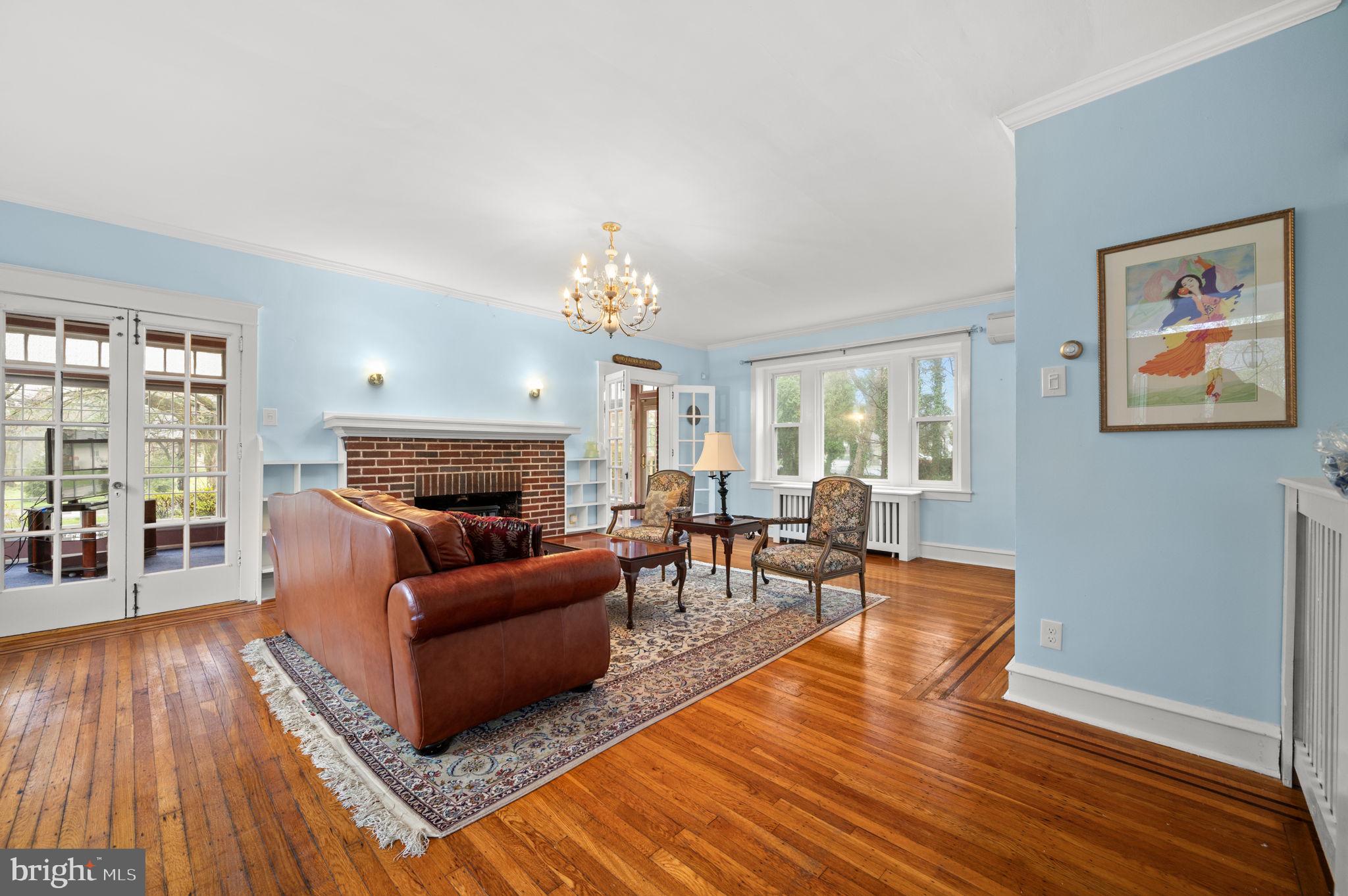 332 South Providence Road Wallingford, PA 19086 - Photo 10 of 69 a living room with furniture and a fireplace