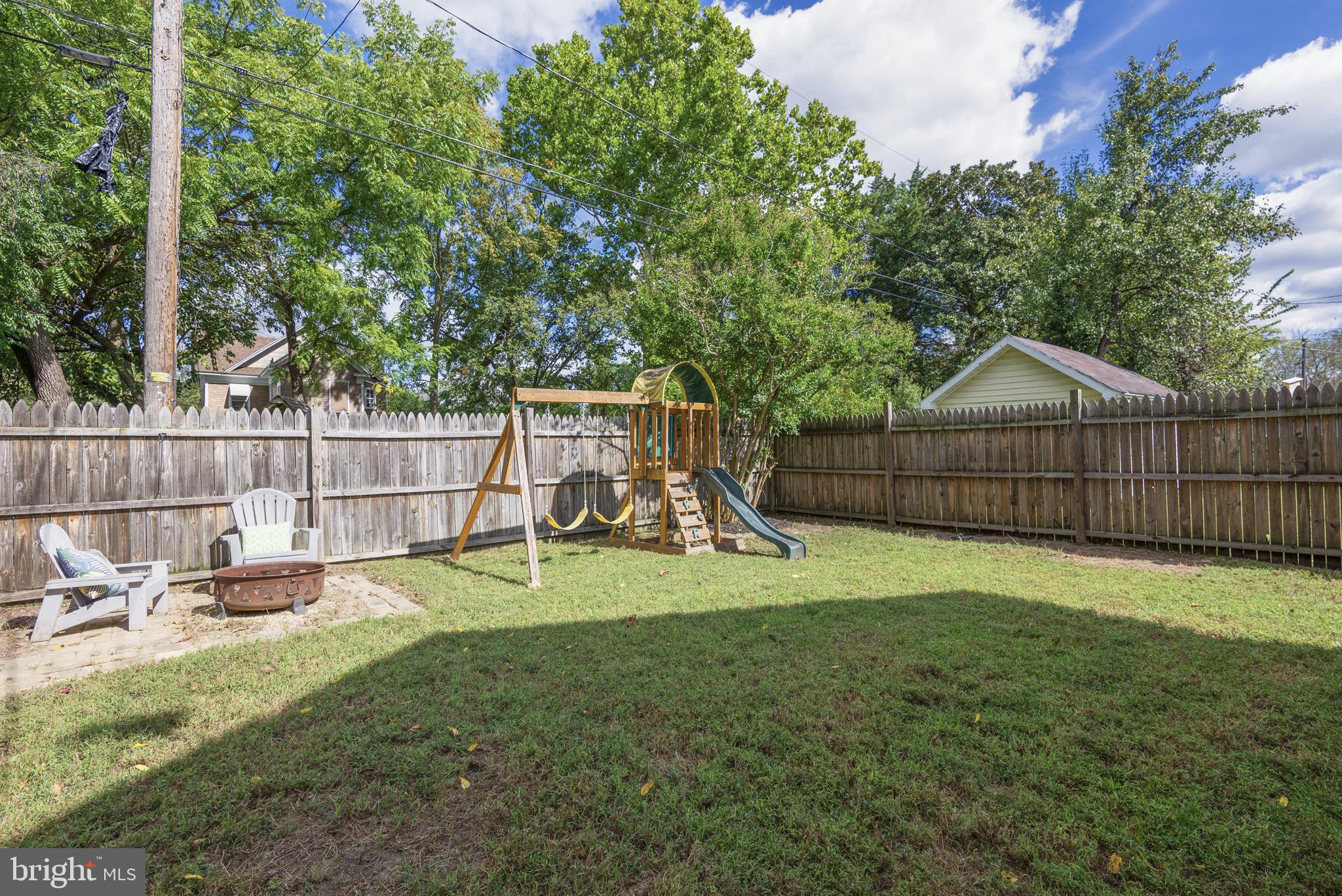 515 Franklin Street Denton, MD 21629 - Photo 21 of 21 a view of backyard with wooden fence and a slide