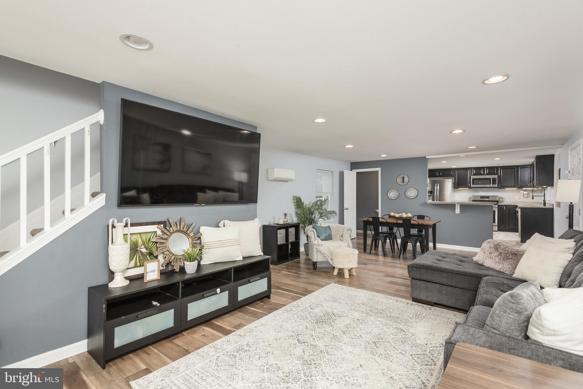 515 Franklin Street Denton, MD 21629 - Photo 3 of 21 a living room with furniture and a flat screen tv