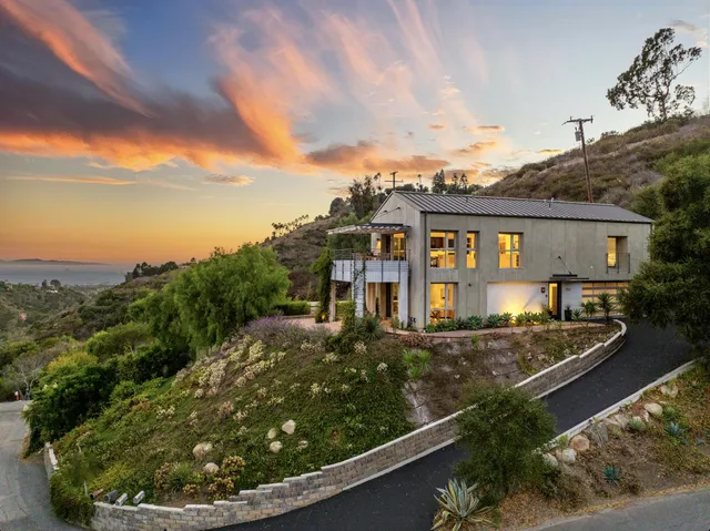 a view of a chairs and table in patio