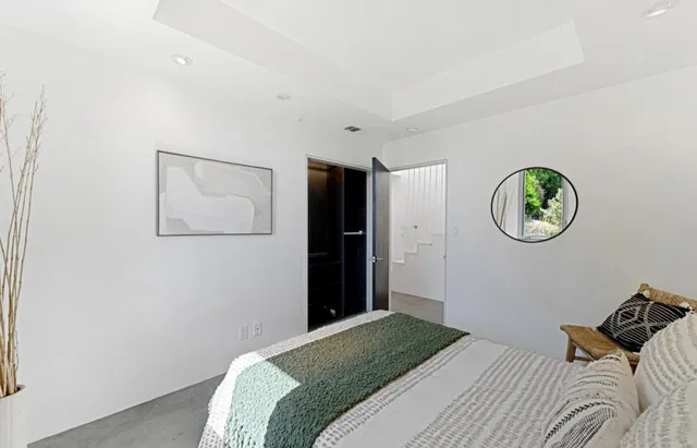 a living room with furniture a lamp and a table