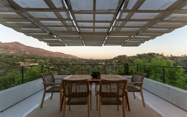 a view of entryway with furniture and wooden floor