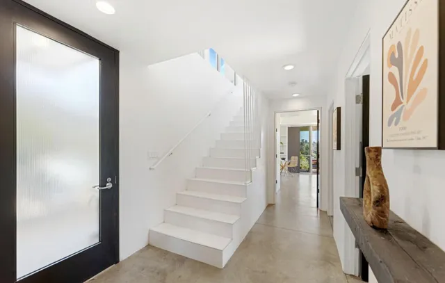 a living room with furniture and flat screen tv