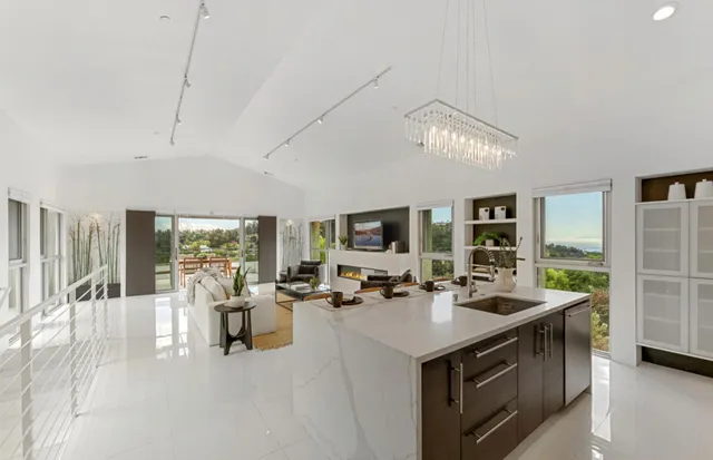 a living room with furniture a rug and a window