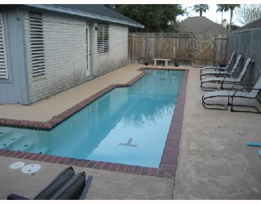 a view of a backyard with a patio