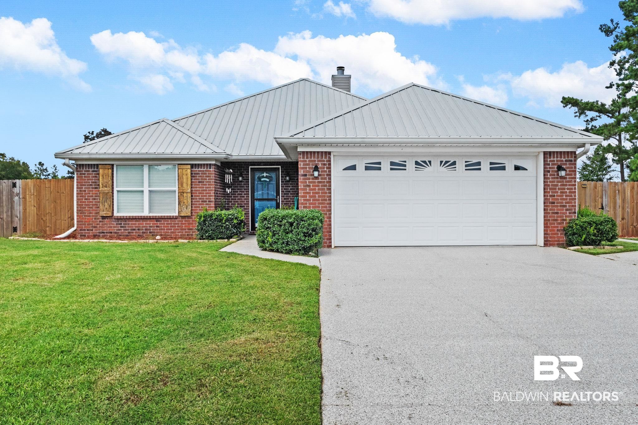 16898 Sugar Loop Foley, AL 36535 - Photo 1 of 67 Ranch-style home with a garage and a front lawn