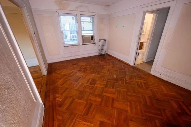 a view of an empty room with a window