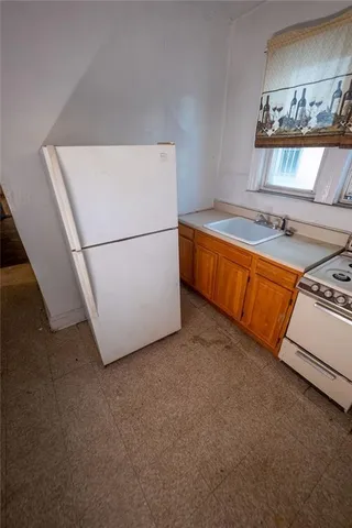 a utility room with closet dryer and washer