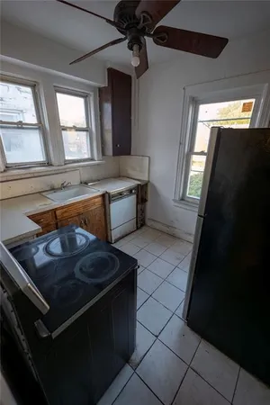 a kitchen with a cabinets and white stainless steel appliances