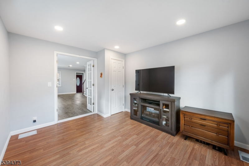 125 Meisel Avenue Springfield, NJ 07081 - Photo 12 of 32 a living room with furniture and a flat screen tv