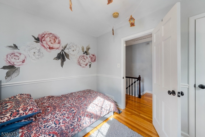 125 Meisel Avenue Springfield, NJ 07081 - Photo 16 of 32 a bedroom with a bed and a table in it