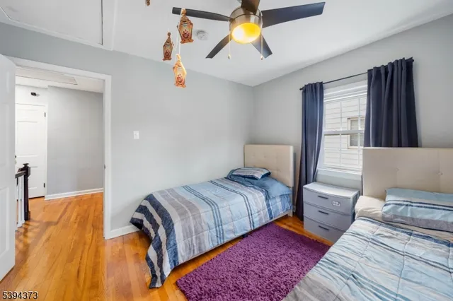 a view of kitchen with kitchen island microwave and cabinets