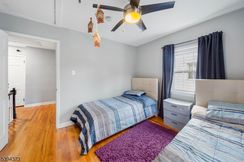125 Meisel Avenue Springfield, NJ 07081 - Photo 19 of 32 a bedroom with a bed and wooden floor