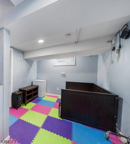 125 Meisel Avenue Springfield, NJ 07081 - Photo 23 of 32 a room with furniture and a flat screen tv