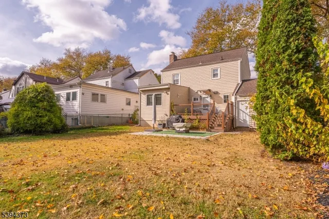 a view of a house with a yard and garage