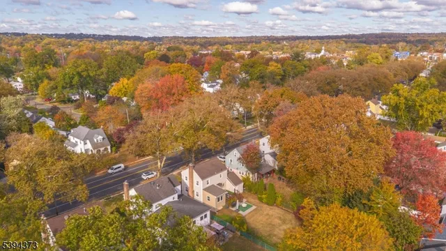 an empty room with windows and fireplace