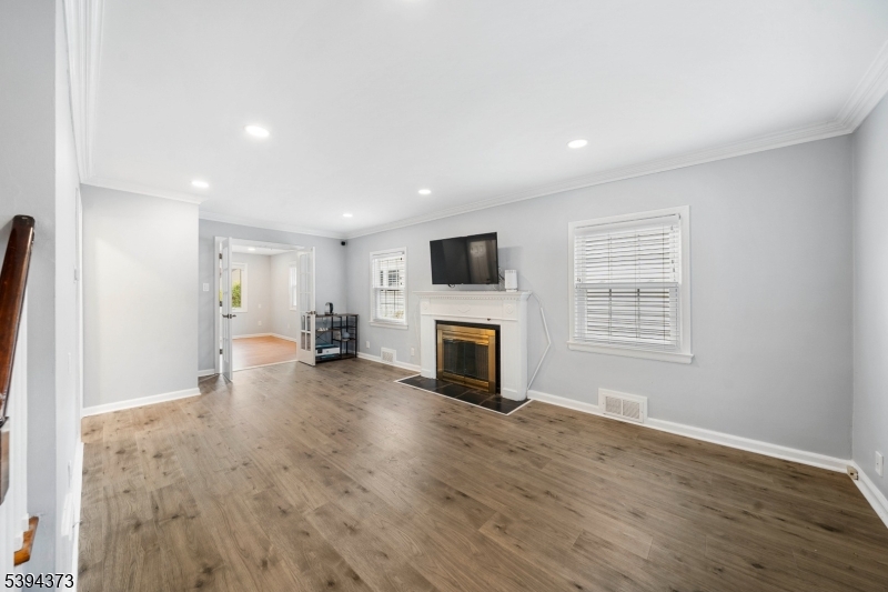 125 Meisel Avenue Springfield, NJ 07081 - Photo 7 of 32 a view of a livingroom with a fireplace a window and a fireplace
