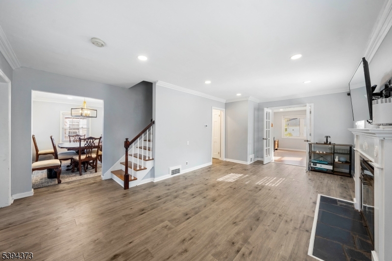125 Meisel Avenue Springfield, NJ 07081 - Photo 8 of 32 a view of a livingroom with furniture and a flat screen tv
