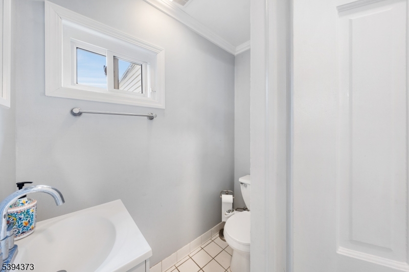 125 Meisel Avenue Springfield, NJ 07081 - Photo 9 of 32 a bathroom with a sink and toilet