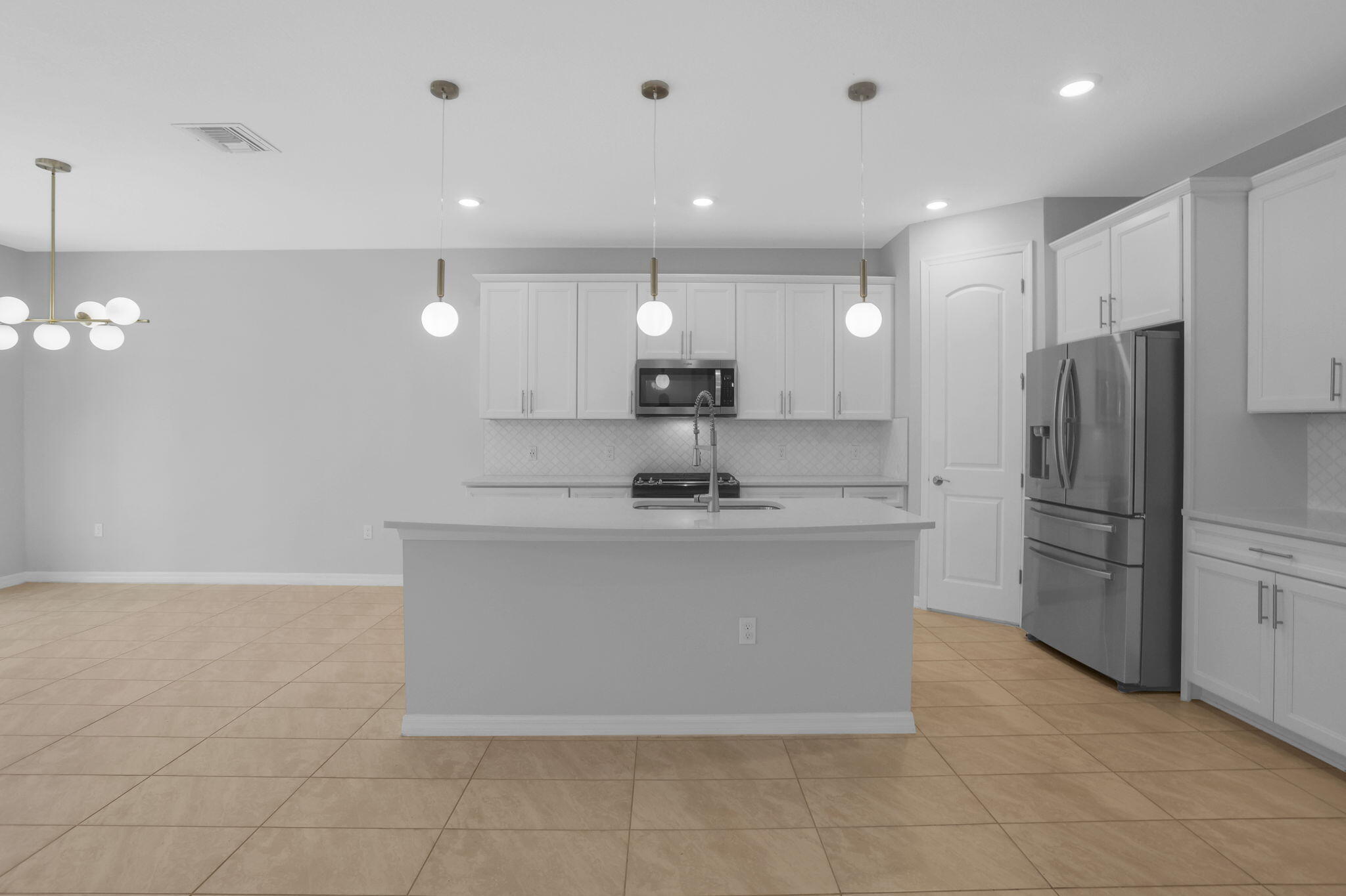 8296 Vaulting Drive Lake Worth, FL 33467 - Photo 12 of 62 a view of kitchen with stainless steel appliances granite countertop a refrigerator a sink and a stove