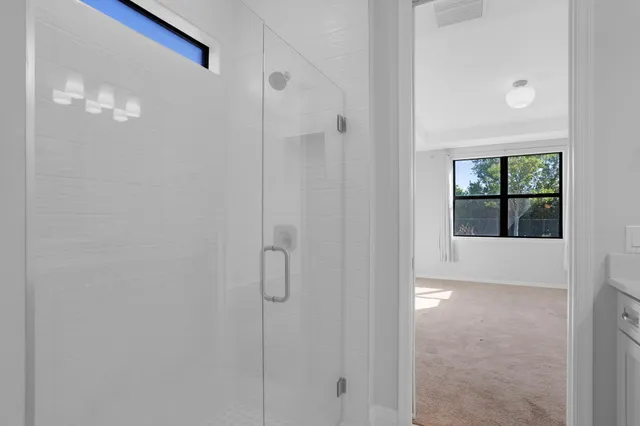 a bedroom with bed and a window