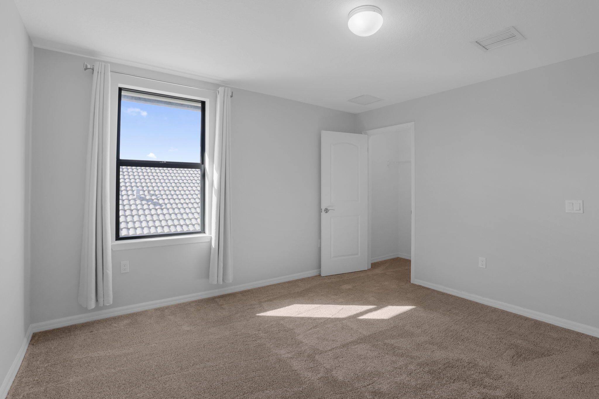 8296 Vaulting Drive Lake Worth, FL 33467 - Photo 45 of 62 an empty room with windows