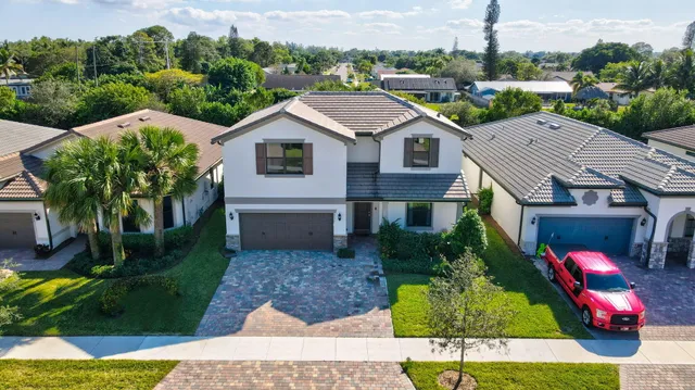 an aerial view of residential houses with city view