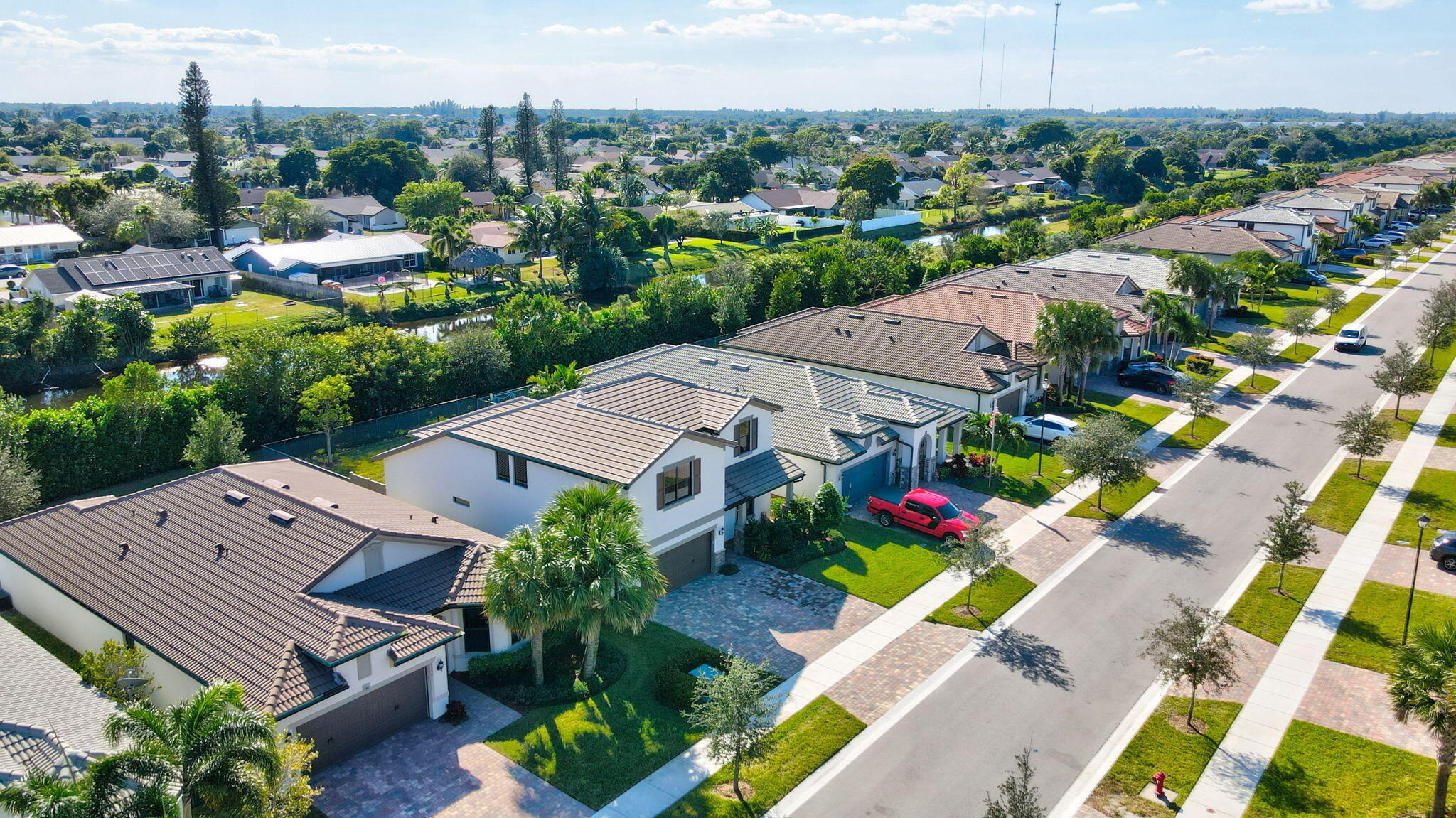 8296 Vaulting Drive Lake Worth, FL 33467 - Photo 51 of 62 an aerial view of a house with a garden