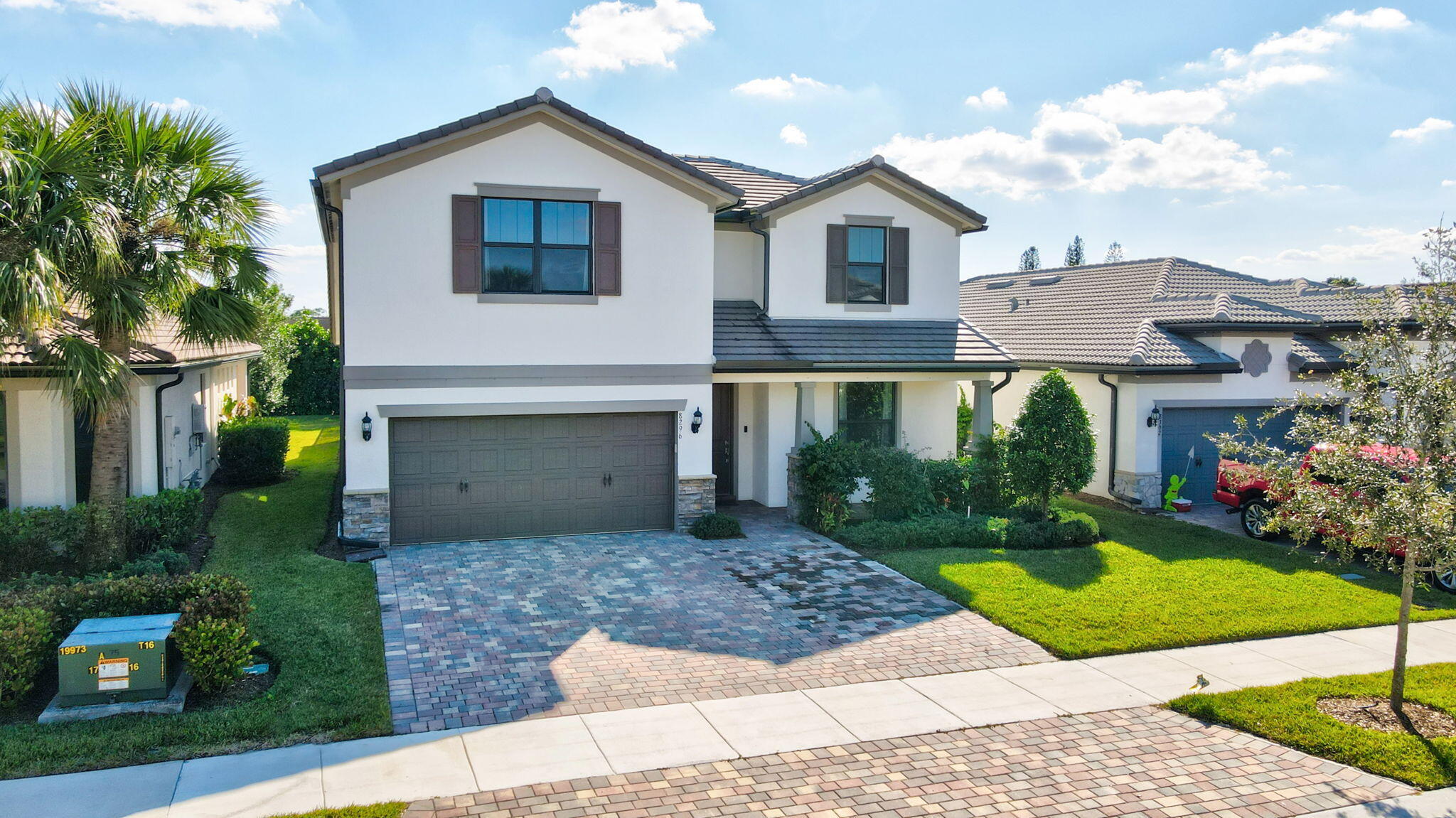 8296 Vaulting Drive Lake Worth, FL 33467 - Photo 62 of 62 a front view of a house with garden