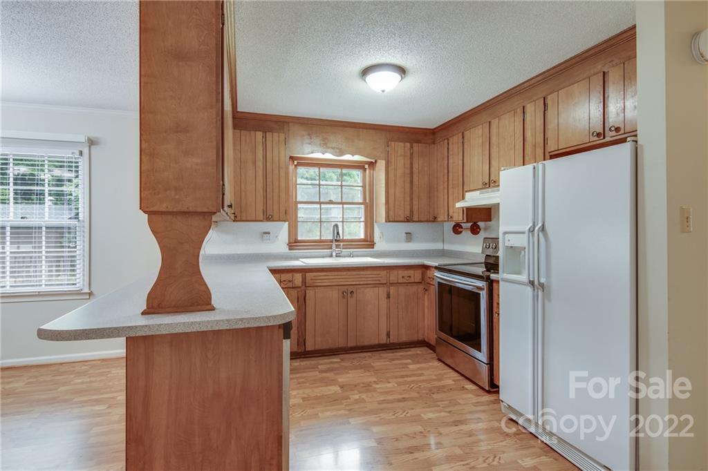 5338 Mt Gallant Road Rock Hill, SC 29732 - Photo 11 of 31 a kitchen with refrigerator and window