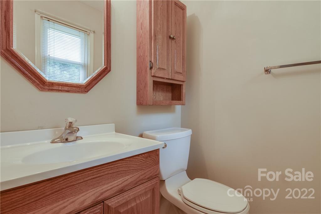5338 Mt Gallant Road Rock Hill, SC 29732 - Photo 22 of 31 a bathroom with a sink a toilet and mirror