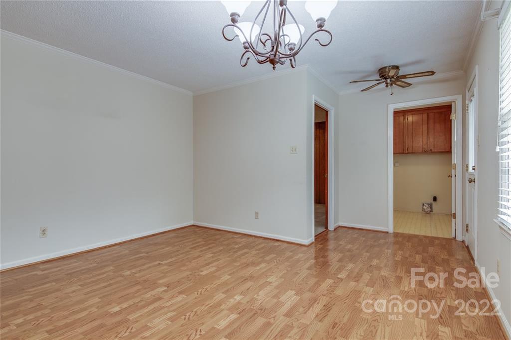 5338 Mt Gallant Road Rock Hill, SC 29732 - Photo 6 of 31 a view of a room with wooden floor and chandelier