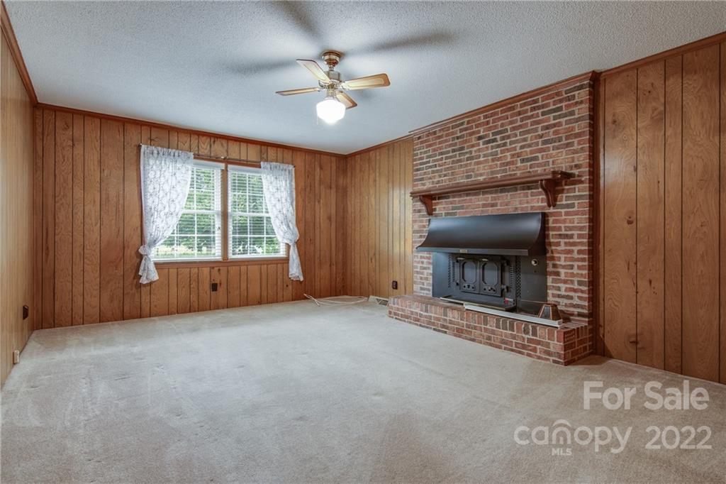 5338 Mt Gallant Road Rock Hill, SC 29732 - Photo 8 of 31 an empty room with windows and fireplace