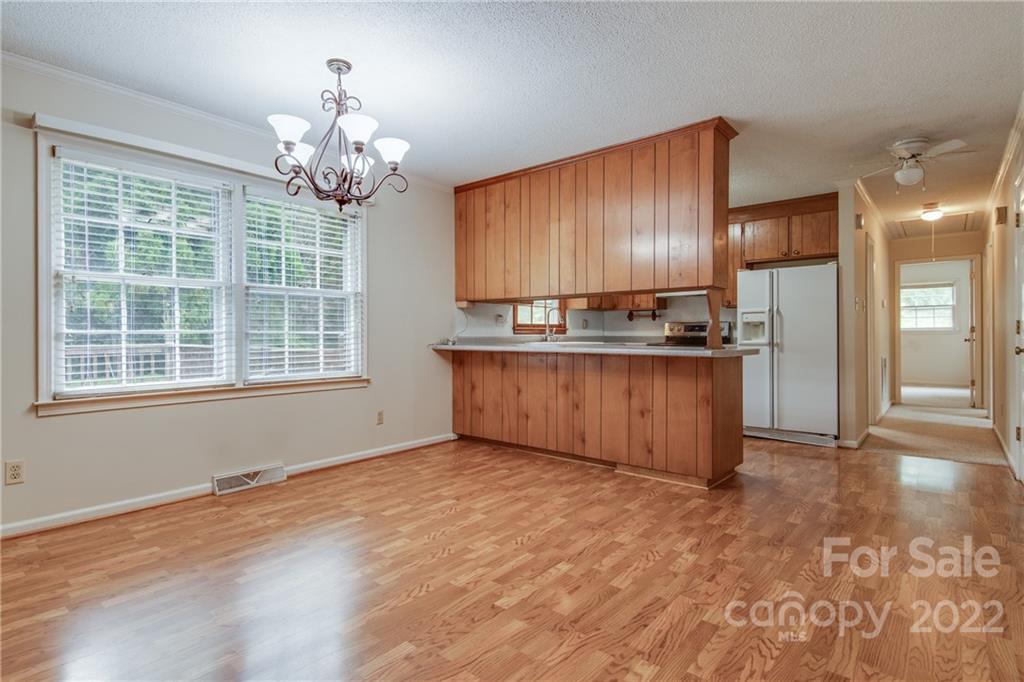 5338 Mt Gallant Road Rock Hill, SC 29732 - Photo 10 of 31 a view of a kitchen with a stove wooden floor and a kitchen