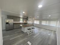 1220 Tasman Drive, Unit 87D Sunnyvale, CA 94089 - Photo 12 of 16 a kitchen with a sink and chairs