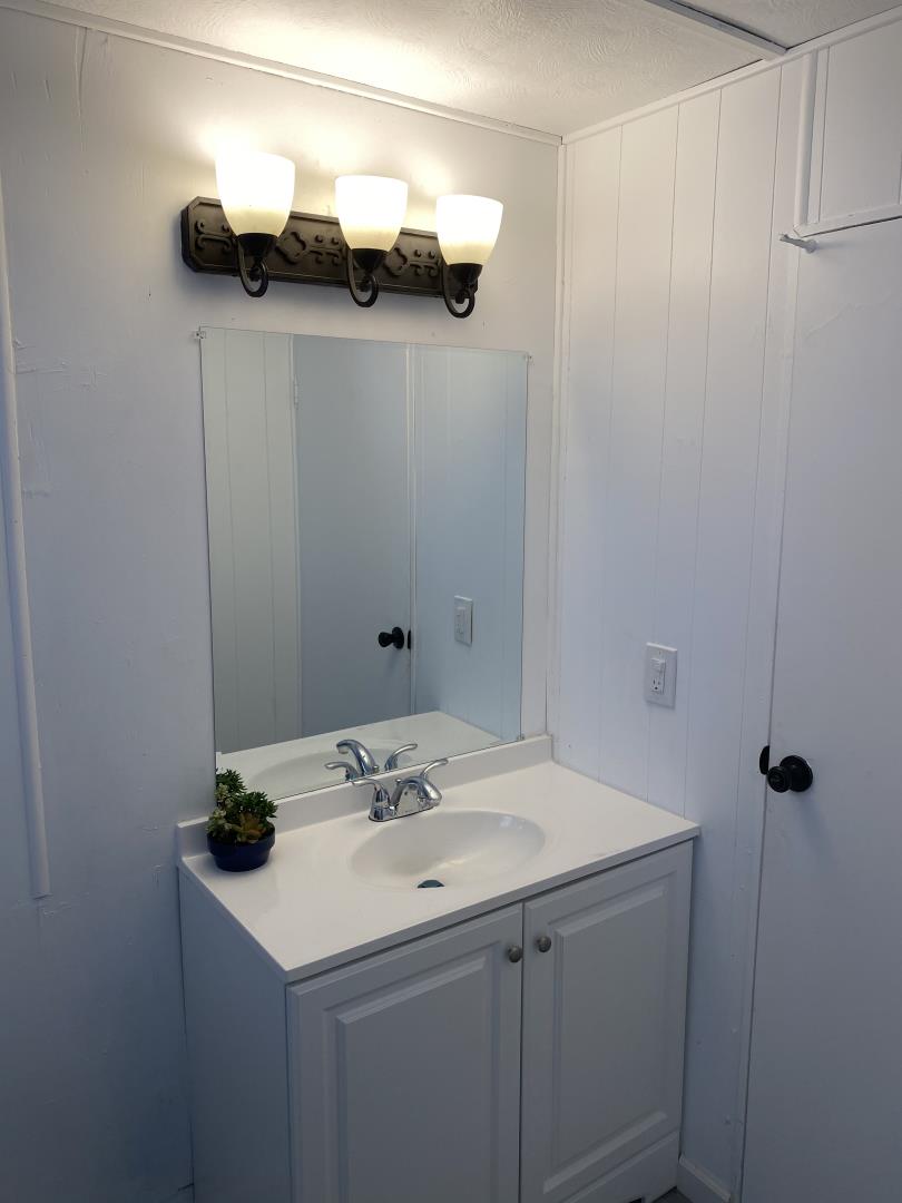 1220 Tasman Drive, Unit 87D Sunnyvale, CA 94089 - Photo 3 of 16 a bathroom with a sink and a mirror
