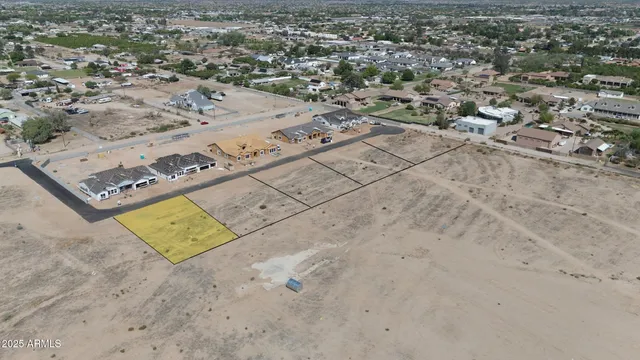 an aerial view of a parking space with city view