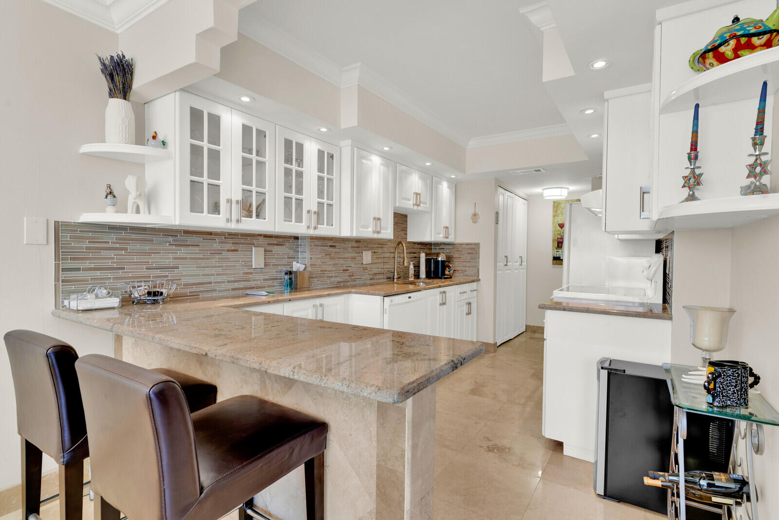 a view of kitchen with stainless steel appliances cabinets a counter top space and a sink