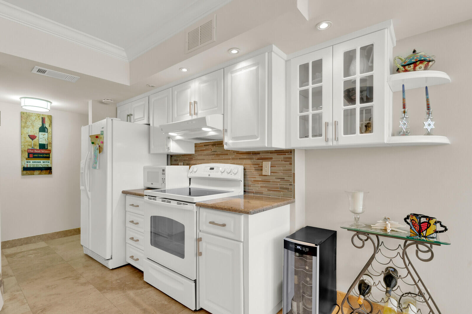 799 Jeffery Street, Unit 4070 Boca Raton, FL 33487 - Photo 11 of 41 a kitchen with stainless steel appliances granite countertop a stove and a refrigerator