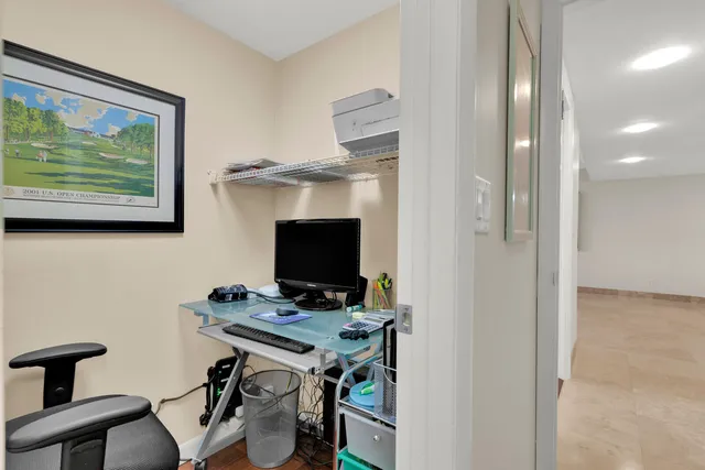 a bedroom with a bed and a lamp