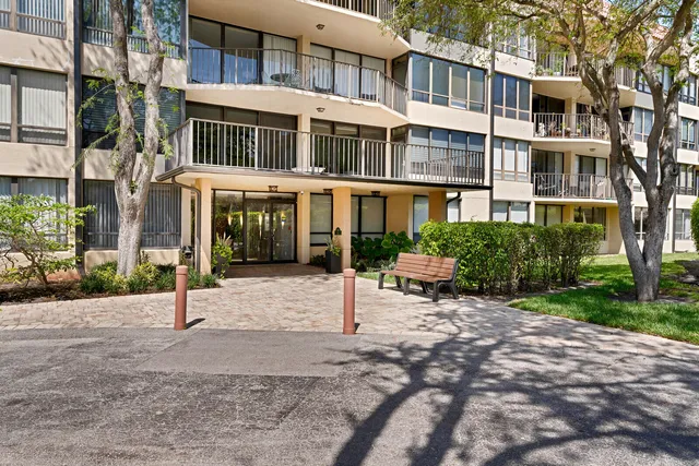 a view of a room with gym equipment and floor to ceiling window