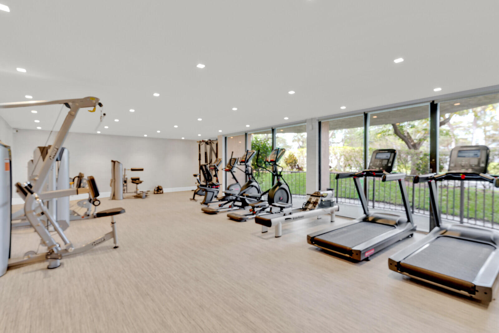 799 Jeffery Street, Unit 4070 Boca Raton, FL 33487 - Photo 23 of 41 a view of a gym with lots of furniture and floor to ceiling window