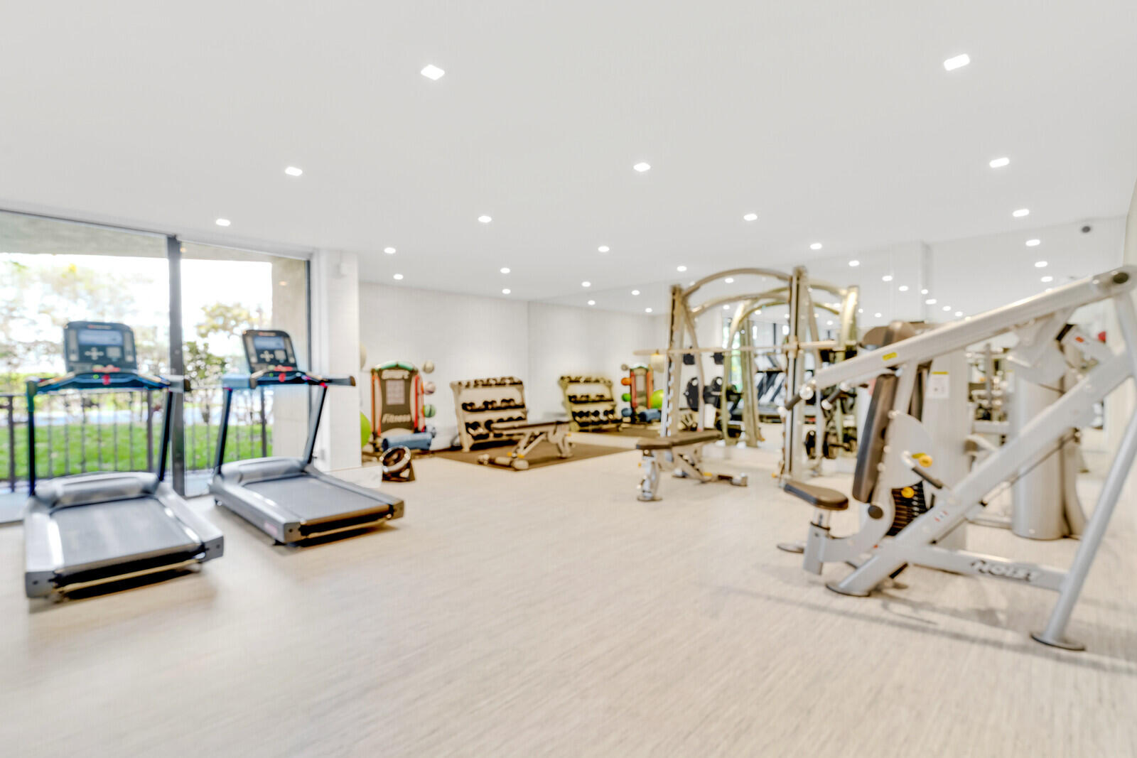 799 Jeffery Street, Unit 4070 Boca Raton, FL 33487 - Photo 24 of 41 a view of a room with gym equipment and floor to ceiling window